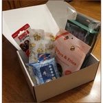 Dog Box: Kong Wubba, Bocce Treats, Bandana, Earth Rated Poop Bags, Wipes. Fixed Price $15.00.