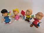 Peanuts 3 Figure Set Just Play Charlie Brown Sally Linus Lucy Holding Toys. Fixed Price $15.95.