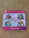 Disney Princess Booster Pin Set Aurora, Rapunzel, Ariel, & Jasmine New On Card. Fixed Price $45.00.